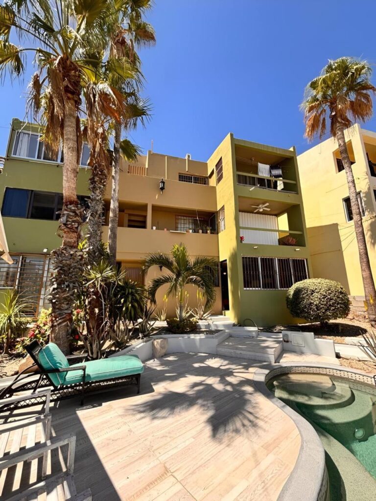 Los Cabos Bahia Del Tezal Located in the desirable ocean side area of Cabo San Lucas, within Bahía del Tezal, this bright and well-maintained 2-bedroom, 2-bathroom condo offers one of the best value opportunities in Cabo. The unit features a functional open layout with great natural light, a clean and inviting living space, and move-in ready condition. Ideal for full-time living, a vacation getaway, or a rental investment. Just minutes to Medano Beach and close to shopping, dining, and grocery stores. A great opportunity for savvy buyers seeking rental income potential and strong value. The building offers a rooftop common area with pool, lounge area, and ocean, city, and mountain – 811 Nopal, San Jose del Cabo, BS