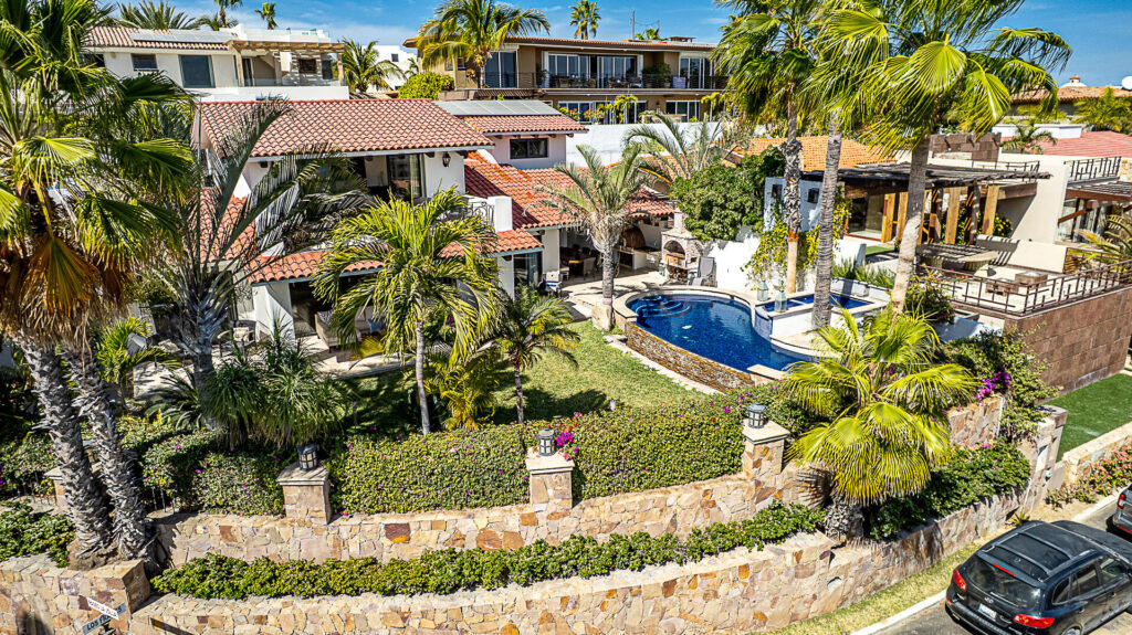 Los Cabos Los Valles Sophisticated and solidly built, this 5,588 sq.ft. estate in Club Campestre offers luxury living with exceptional construction quality rarely found in Los Cabos. Residents enjoy exclusive access to a private beach club and world-class golf course, all just minutes from San Jose vibrant dining and culture. The home features 4 ensuite bedrooms, a 3-stop elevator, and a Generac backup system. Entertain in style with a chef's kitchen, wine room with Tzalam wood cabinetry, and an outdoor BBQ area with fire pit. Relax by the heated pool or on the Jacuzzi terrace with partial ocean – C5 1 C Esq Frailes y Poste, San Jose del Cabo, BS