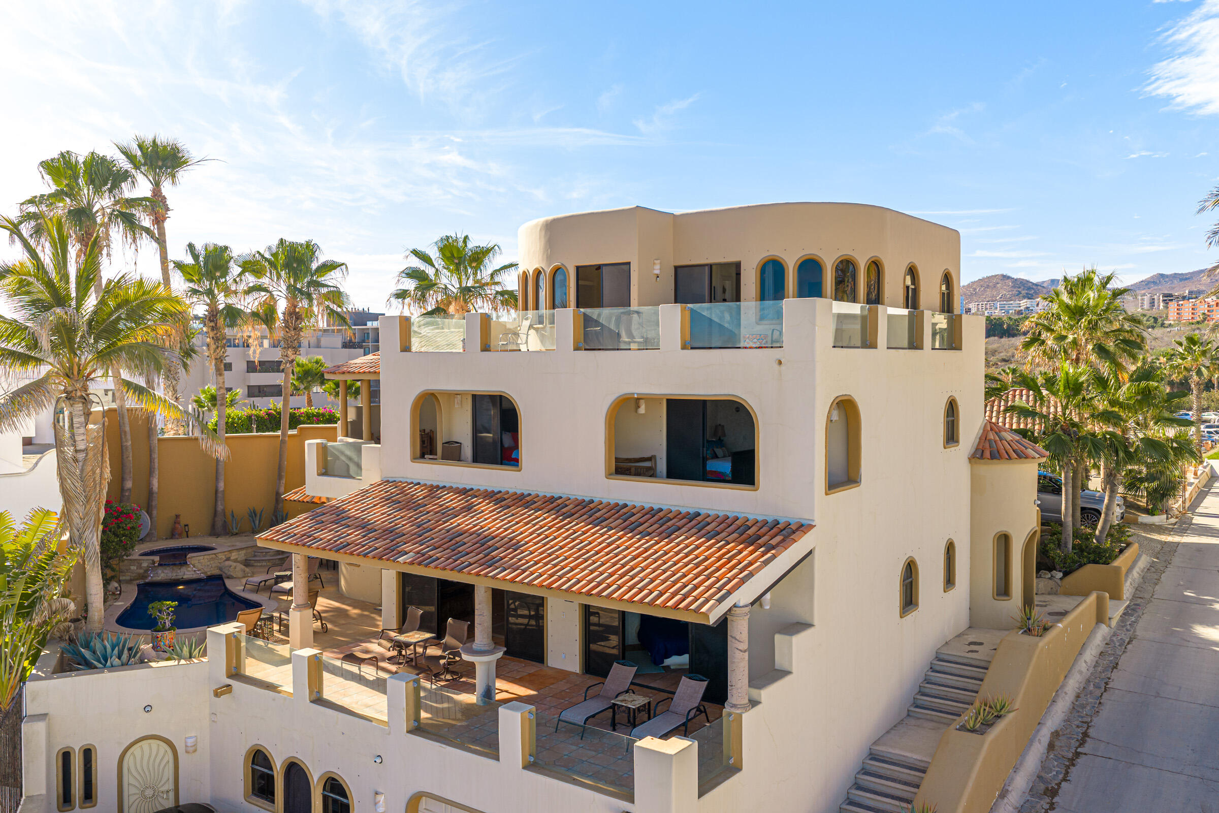 Los Cabos El Posito We are excited to introduce Casa Elisabeth, an amazing, newly constructed custom home in the private El Posito area of Todos Santos. Located just three rows back from the beach, this three-bedroom, three-full and two-half bathroom residence offers every amenity desired for a tropical paradise. The downstairs features an open-concept living room, dining room, and a fully stocked kitchen with brand-new appliances, including a dishwasher. The main floor also includes a laundry room and an outdoor water feature with a professionally designed rock wall. The principal bedroom downstairs offers a unique indoor/outdoor bathroom with two showers and an outdoor bathtub.Each of the three bedrooms includes an en-suite bathroom with double vanities. The upstairs bedroom features its own private furnished terrace and access to one of four large patios, complete with a bar area and outdoor furniture perfect for enjoying ocean sunsets. Additionally, a shaded third-floor observation deck provides panoramic ocean and mountain for sale