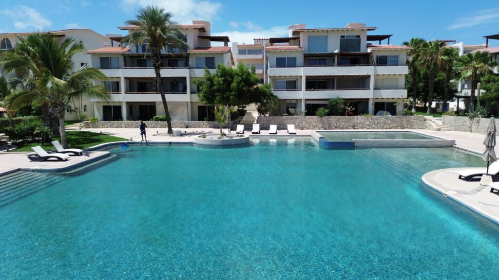 Los Cabos Villas De México Condo 201 is a 3-bedroom, 2.5-bath pentgarden in Villas Mexico, inside Campestre San José. It delivers the mix everyone wants here: privacy, outdoor living, and convenience. The layout is bright and functional, with the living area opening directly to a private pentgarden terrace — a standout space for relaxing, dining, or entertaining.All three bedrooms are well-sized. The primary suite offers its own balcony, a spacious bathroom, and generous closet space. The kitchen and living area are designed for everyday comfort and practicality. The condo also includes underground parking with a private storage unit, which is a real advantage in this community. Campestre owners have the option to access the Campestre Beach Club, the Jack Nicklaus golf course, gym, pickleball courts, and enjoy 24/7 gated security.The location is one of the big selling points: minutes from the beach, supermarkets, schools, restaurants, and downtown San José. Condo 201 works well as a full-time home, an easy lock-and-leave getaway, or a strong rental investment with consistent demand. – Carr. Tanspeninsular, Km 6.5, Cabo Corridor, BS