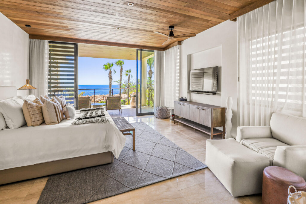 Los Cabos Morgan Residences Morgan Residences Condo 306 offers 67 m² of functional living space with one bedroom, one and a half baths, and a private balcony overlooking the city. The open floor plan connects the kitchen, dining, and living areas with marble-style tile throughout. The kitchen has granite counters, white cabinets, and an island with seating. The bedroom includes an ensuite bathroom with a walk-in shower and opens to the terrace. A separate half bath includes in-unit laundry. The building features a rooftop pool, gym, BBQ area, and – Concha 2 KM 15 Carr. Transpeninsular, Cabo Corridor, BS