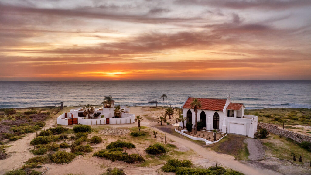 Los Cabos Elias Calles Welcome to Rancho 82 -- a rare 2.4-acre oceanfront property offering 190 feet of Pacific coastline, two charming Baja-style homes, and endless potential. With five titled lots, and easy access from Highway 19, this property could become a family compound, boutique retreat, or collection of oceanfront villas. The main home offers 3 bedrooms and 3 baths; the guest casita includes 3 bedrooms, 2 baths, and a rooftop terrace. Both feature authentic Mexican craftsmanship, handmade tiles, and sweeping ocean – Rancho 82, Pacific, BS