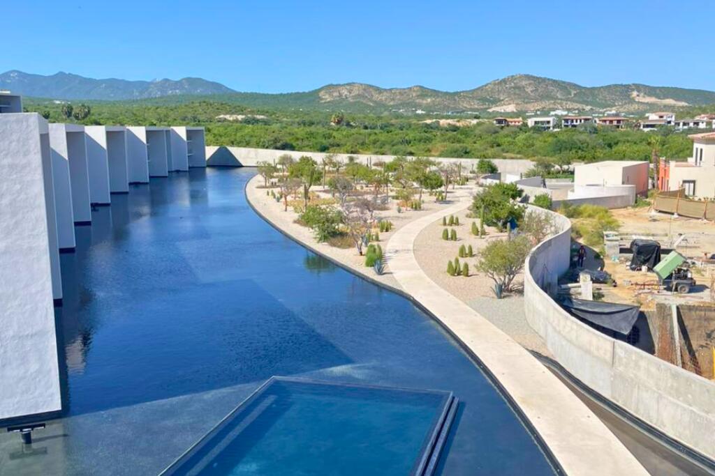 Los Cabos Dunna Welcome to Dunna - A New Standard of Luxury in Cabo. More than a residence, Dunna is a vibrant, fully integrated community where luxury, culture, and recreation converge. Designed by renowned architect Sordo Madaleno, this visionary development seamlessly blends timeless elegance with natural tranquility, offering meticulously crafted residences and garden villas complemented by world-class amenities. Elevated Living, Unmatched Experiences Choose from 13 thoughtfully designed floor plans from 2 - 5 bedrooms ranging from 1,475 - 6,458 sq. ft., featuring seamless indoor-outdoor living, elegant finishes, private rooftops, Jacuzzis, and lush garden terraces. Resort-Style AmenitiesEnjoy unparalleled amenities, including:" Infinity pools (Adults-only, Family, Kids & Oasis)" State-of-the-art wellness & fitness center" Luxury spa (sauna, steam, ice baths, massage suites)" Exclusive rooftop lounges & panoramic for sale